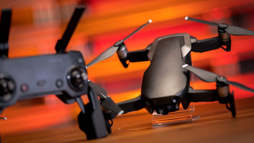 DJI Mavic Air, drones, photography. The Mavic Air design has smooth lines and rounded edges, with classy color combinations in Red Flame & black, Arctic White & black, and Onyx Black.
