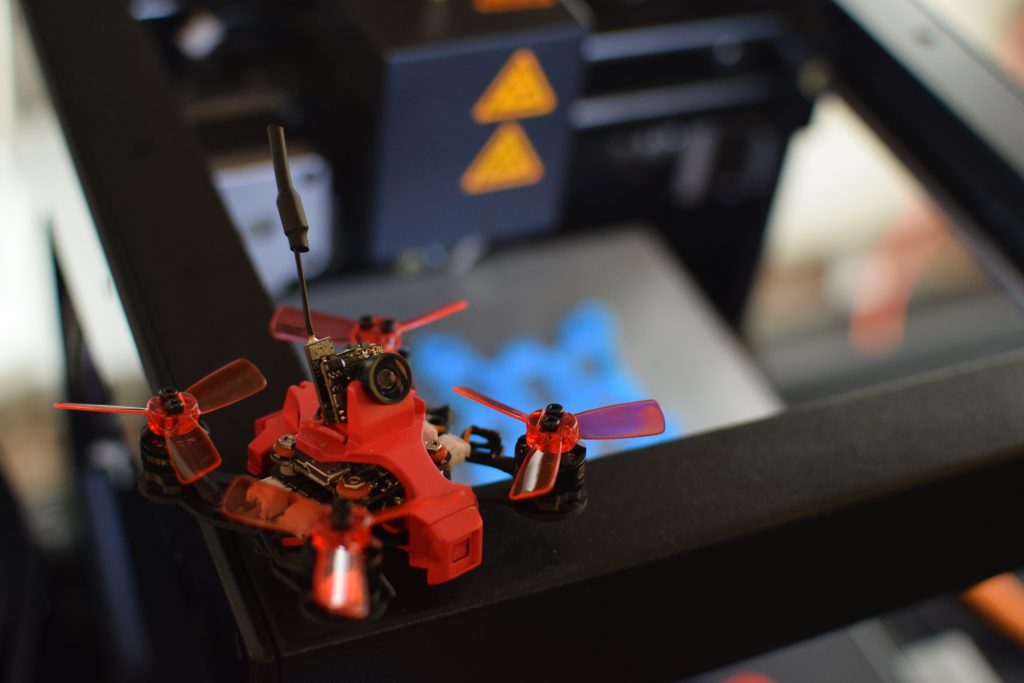 Drone, CES, Drone Rodeo. The RC EYE Imprimo sits on a 3D printer, which created the drone frame.