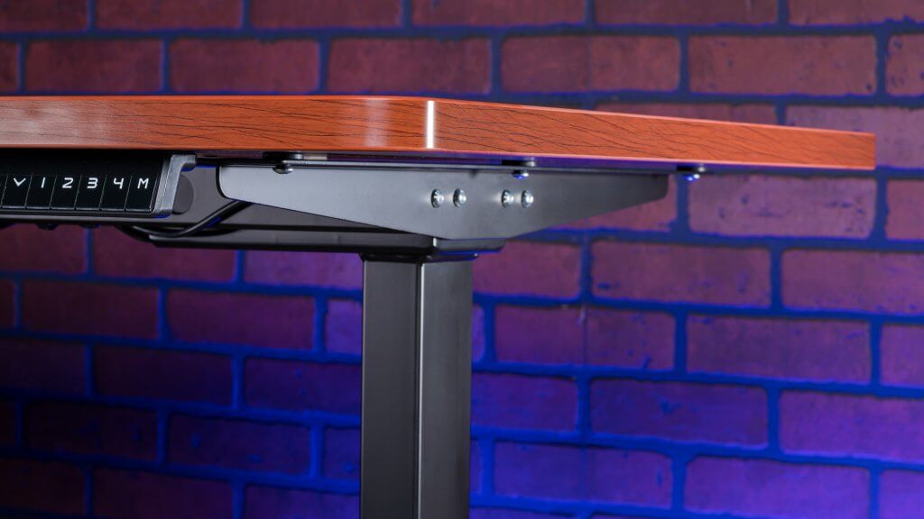 Aimezo's standing desk uses a cherry tabletop and black frame for a modern style that blends in with most aesthetics.