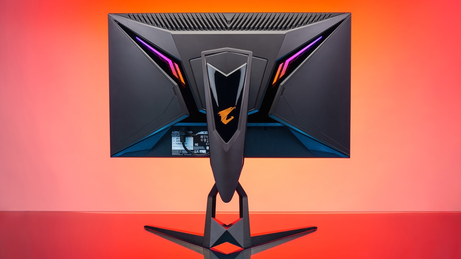 back of the aorus monitor in a red RGB-lit background