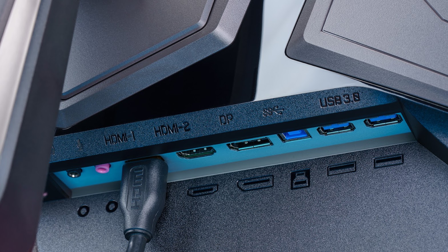 underside ports on an aorus monitor, with an HDMI cable already plugged in