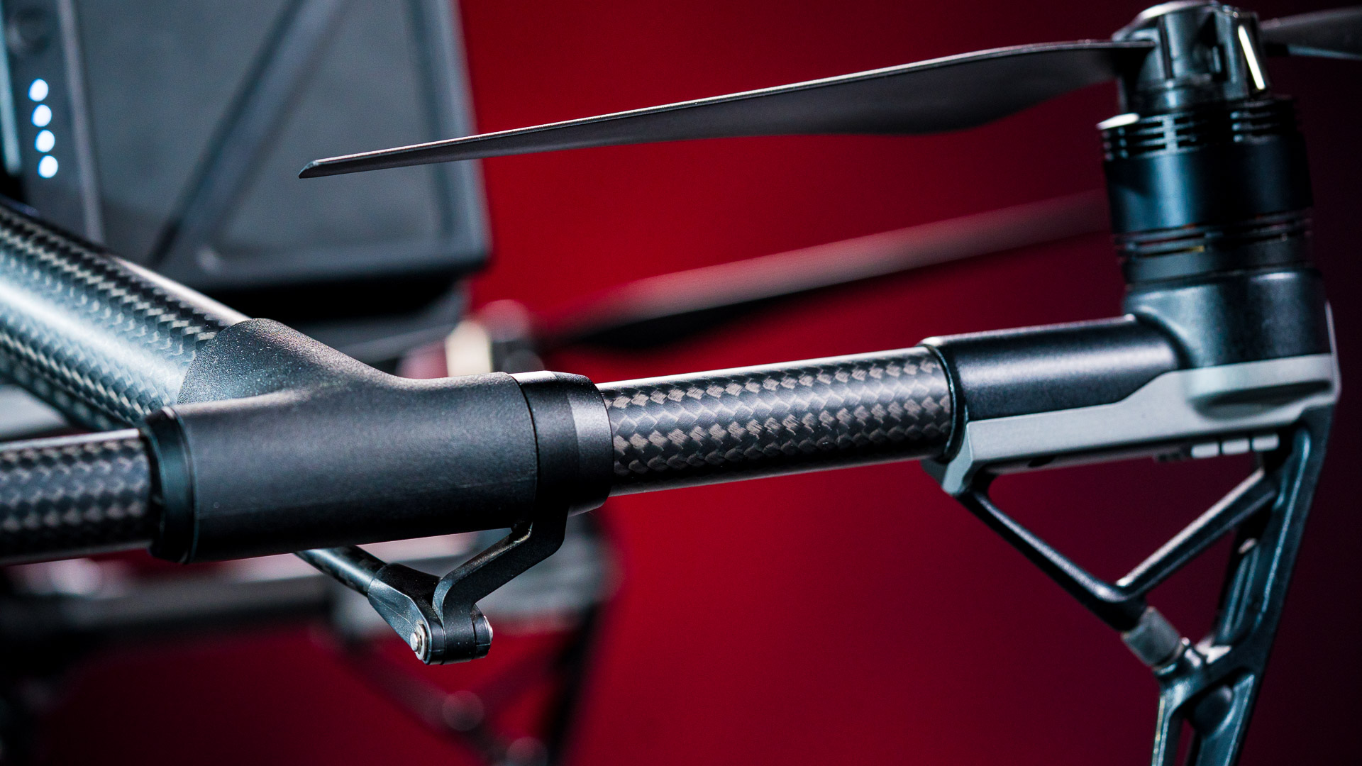 The lightweight carbon fiber frame allows the Inspire 2 to utilize four 15" props and 2kg of thrust per motor to lift the drone for 27 minutes.