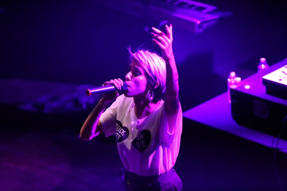 Dev performing on stage at the House of Blues