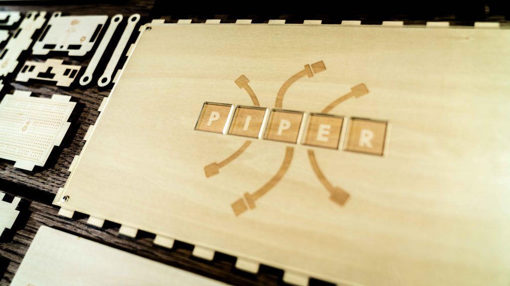 The Piper computer case is made up of laser-cut wooden puzzle pieces, which much be assembled before kids can begin building the PC.